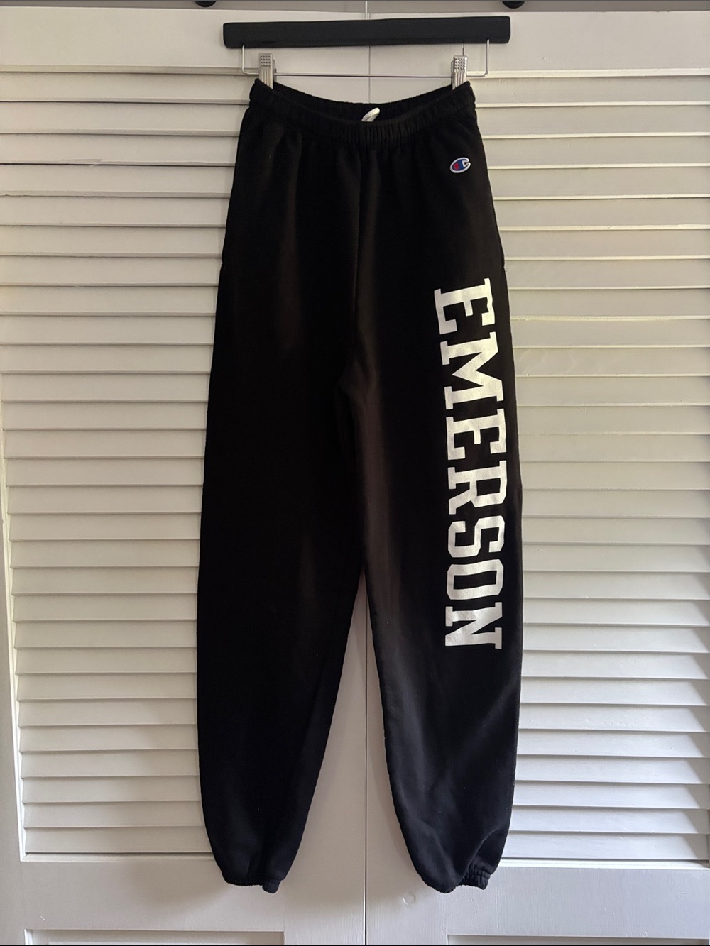 Champion Black Track Pants with White 'EMERSON' Lettering